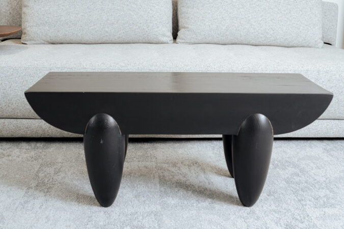 Wooden Coffee Table in Black with Oval Leg Supports